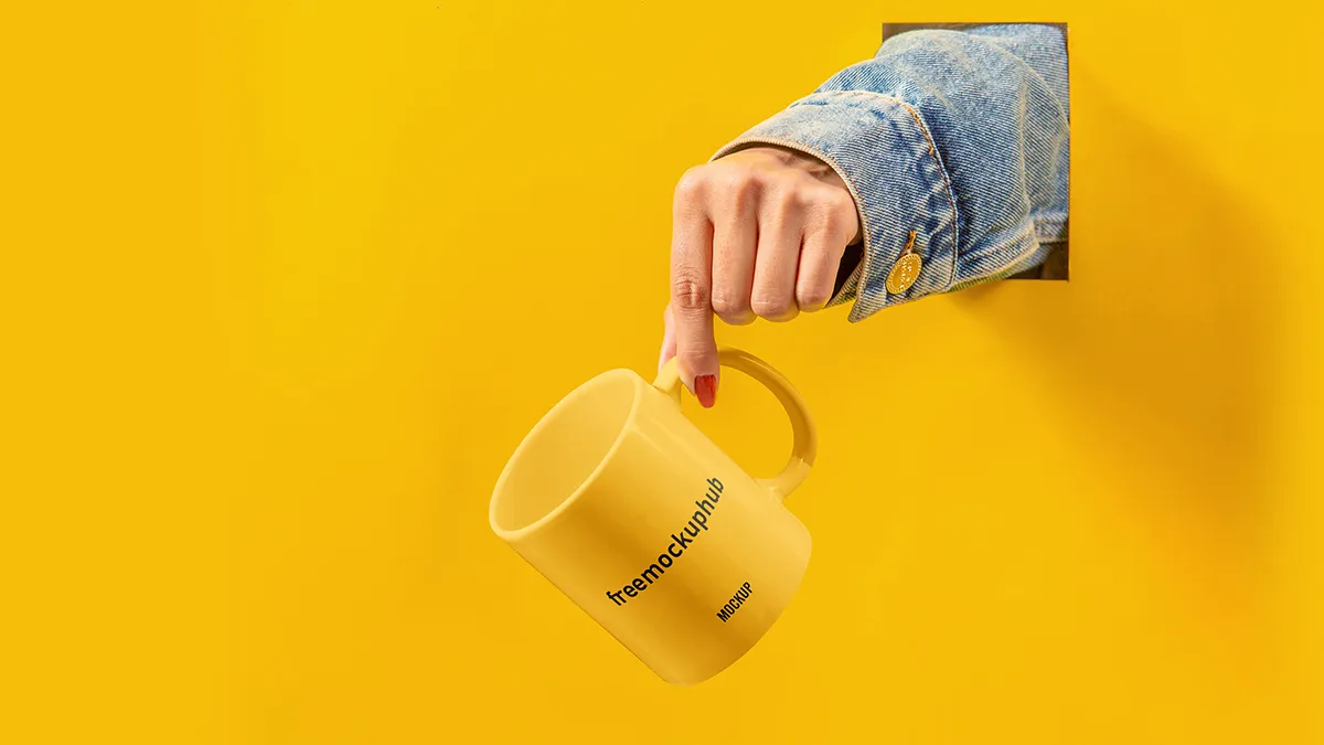 Realistic Cup with Hand Mockup Free PSD for Branding